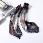 Decorative scarf with intricate patterns on a white surface