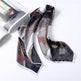 Decorative scarf with intricate patterns on a white surface