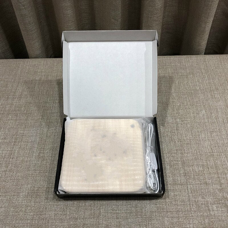 Product packaging with a white item inside on a gray surface
