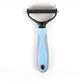 Pet grooming brush with blue handle on a white background