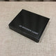 Black box labeled '3D Wooden Lamp' on a textured surface