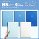 Set of blue notebooks with different designs on a light blue background