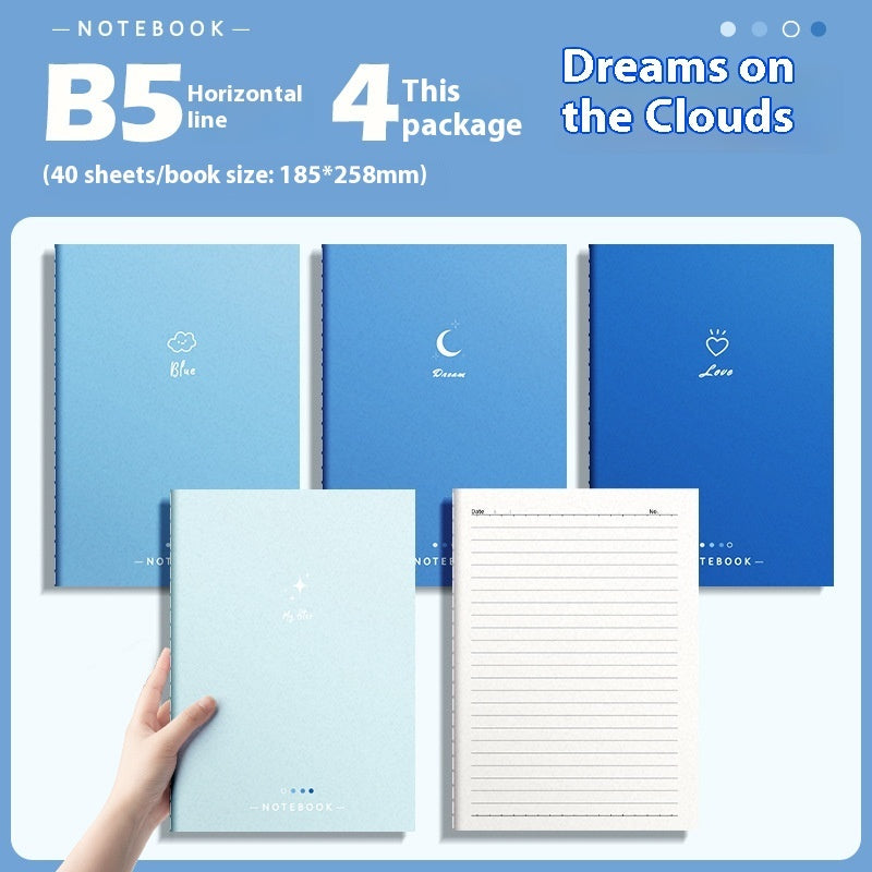 Set of blue notebooks with different designs on a light blue background