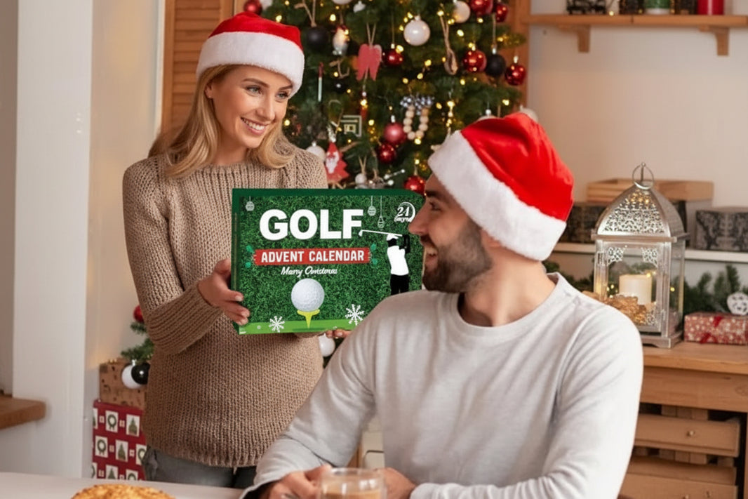 Two people wearing Santa hats in a festive setting with a golf advent calendar.