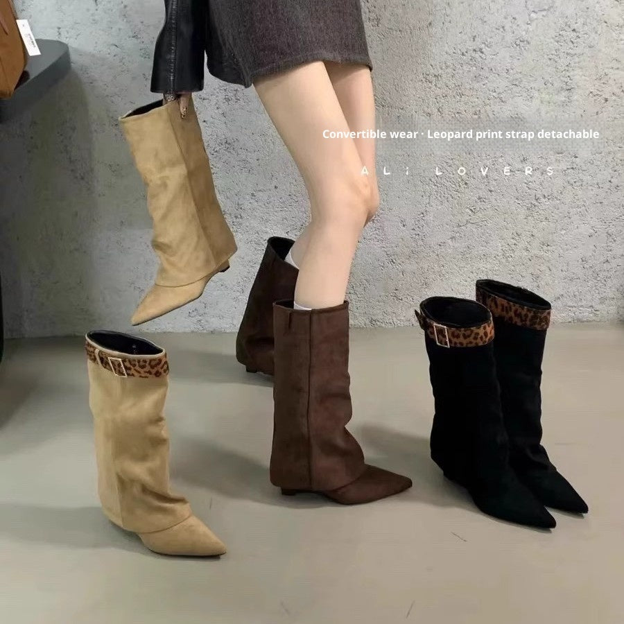 Four pairs of boots in different colors with leopard print straps on a gray floor.