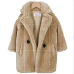 Beige faux fur coat with black buttons on a white background