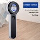 Handheld magnifying glass with sensor switch on a wooden floor