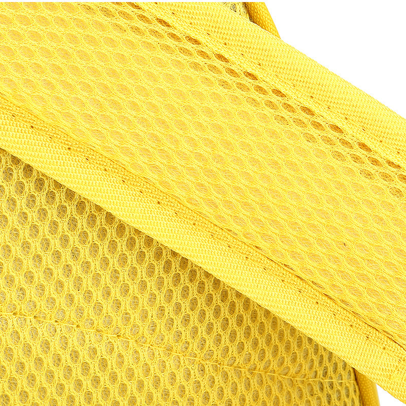 Close-up of a yellow textured fabric with a grid pattern