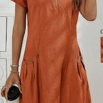 Orange dress worn by a person on a white background