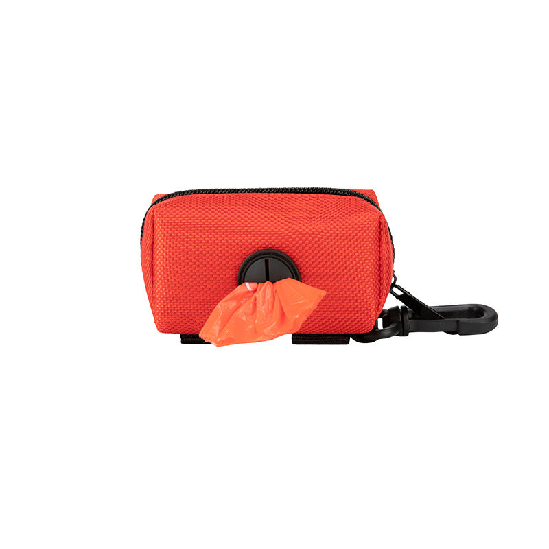 Red pet waste bag dispenser with a black handle on a white background