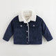Navy blue corduroy jacket with white sherpa lining on a light gray background