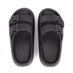Black sandals with multiple straps on a white background