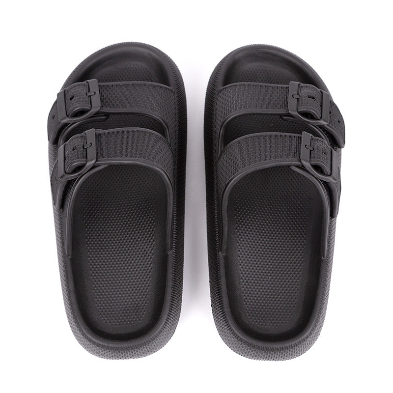 Black sandals with multiple straps on a white background