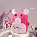 Pink bunny-shaped backpack on a light gray background