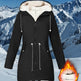 Black winter coat with white fur lining against a snowy mountain background