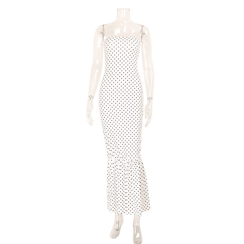 Mannequin wearing a polka dot dress on a white background