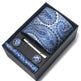 Blue paisley tie set with tie clip and cufflinks in a black box on a white background