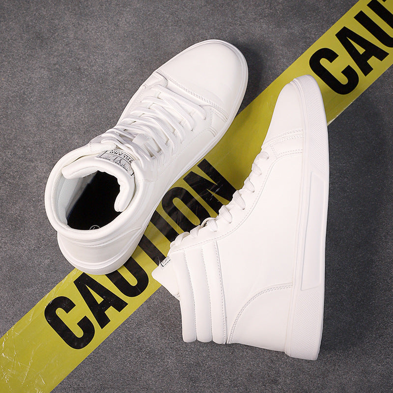 White high-top sneakers on a gray surface with yellow caution tape.
