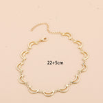 Gold necklace with measurements and weight on a beige background