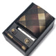 Plaid tie set with cufflinks and tie clip in a black box on a white background