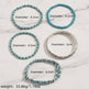 Five beaded bracelets displayed on a wooden surface, with text labels showing diameters ranging from 6.2 cm to 6.