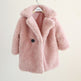 Pink fluffy coat on a white background