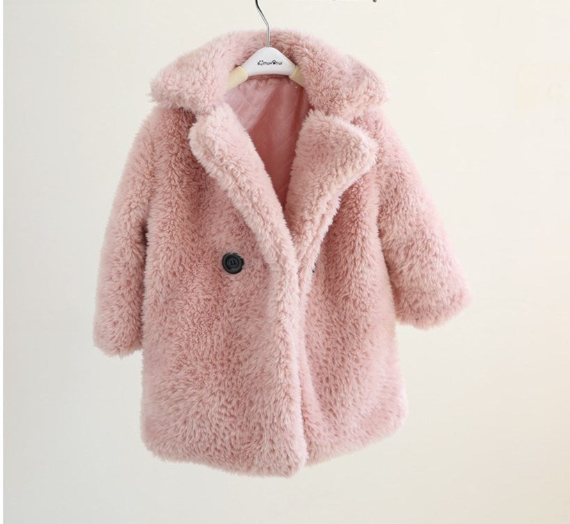Pink fluffy coat on a white background