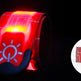 Red and black reflective safety belt with light on a dark background