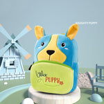 Children's backpack shaped like a dog with 'Little Puppy' text, set against a playful outdoor scene.