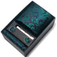 Green paisley tie set with tie clip and cufflinks in a black box on a white background
