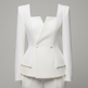 A structured white tailored jacket with long sleeves, a square neckline, and two front buttons, shown on a mannequin against a plain light gray studio background.