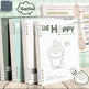 Notebooks with a cartoon character and text on a wooden surface, featuring the brand 'Garliq'.