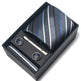 Tie, cufflinks, and tie clip set in a black box on a white background