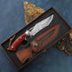 Decorative knife with a wooden handle and leather sheath on a textured surface