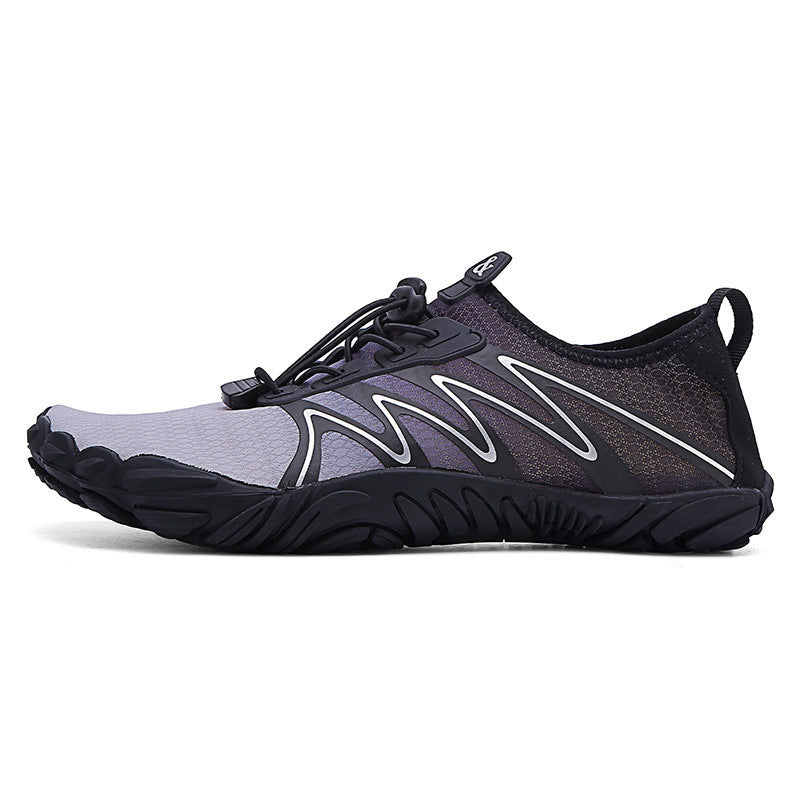 Black and gray athletic shoe on a white background