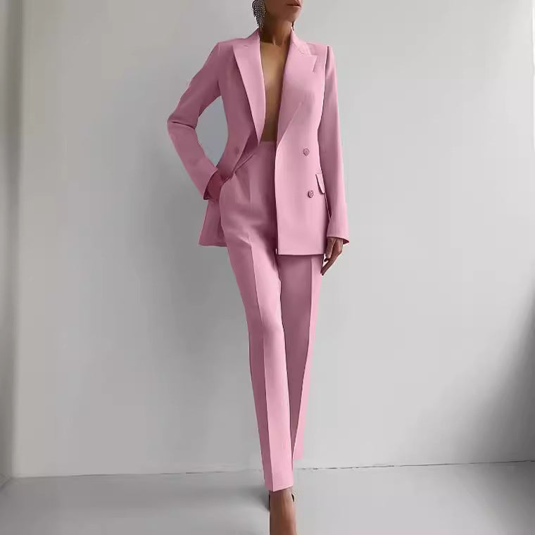Pink suit worn by a person against a plain background