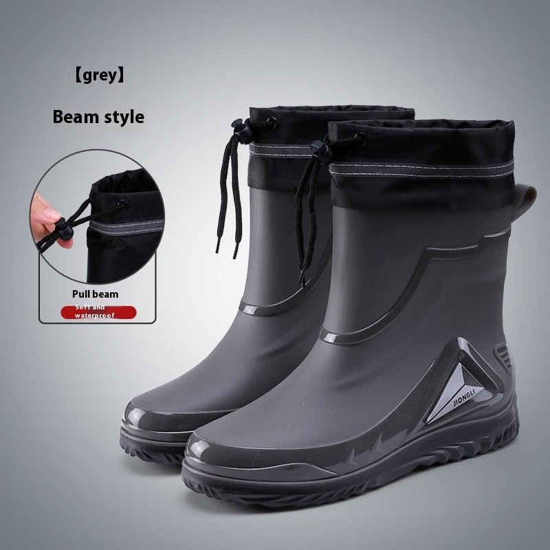 Gray rain boots with pull beam feature on a gray background
