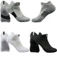 Set of six pairs of gray, black, and white ankle socks on a white background