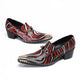 Pair of red, black, and white patterned shoes on a white background