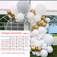 Balloon arch with white, gold, and gray balloons in front of a greenhouse.