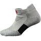 Gray ankle sock with a black patch and red logo on a white background