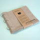 Fabric sketchbook with 'STITCHbook' branding on a light blue background
