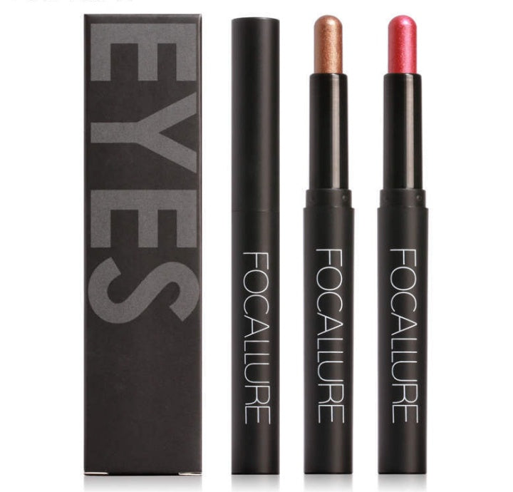 Focallure eye makeup products including two eyeliner pencils and a box on a white background