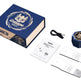 A set of professional tools and accessories displayed on a clean white background, including a blue and beige presentation box, a blue handheld device with a gold emblem, a black USB cable, a white instruction booklet, and two white strap-like pieces with gray textured ends.