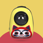 Yellow pet carrier with a red and black cat face design on a yellow background