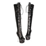 Black sequin knee-high boots on a white background