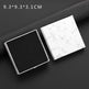 Two square boxes, one black and one with a white marble pattern, on a dark surface.