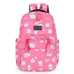 Pink backpack with cat and flower patterns on a white background