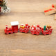 Wooden toy train set with Santa Claus and Christmas trees on a wooden surface
