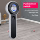 Handheld magnifying glass with pushbutton switch on a wooden floor.